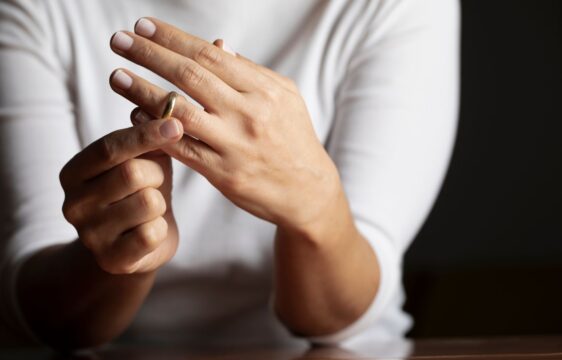 Individual removing wedding ring